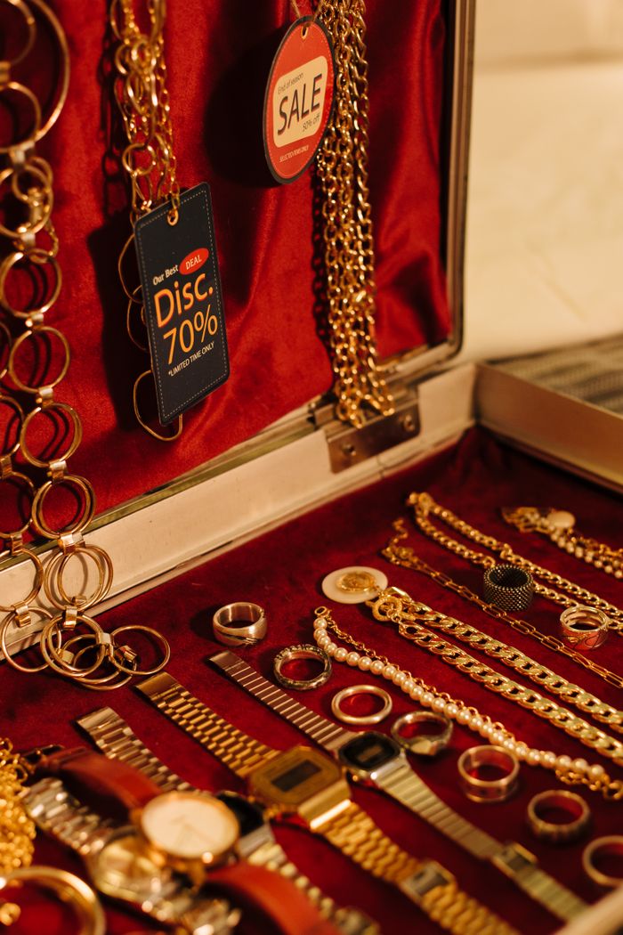 Crafting Captivating Headlines: Your awesome post title goes here Close-up of gold jewelry including chains and watches on sale with a 70% discount tag.